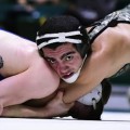 Ohio university wrestler holding competitor down