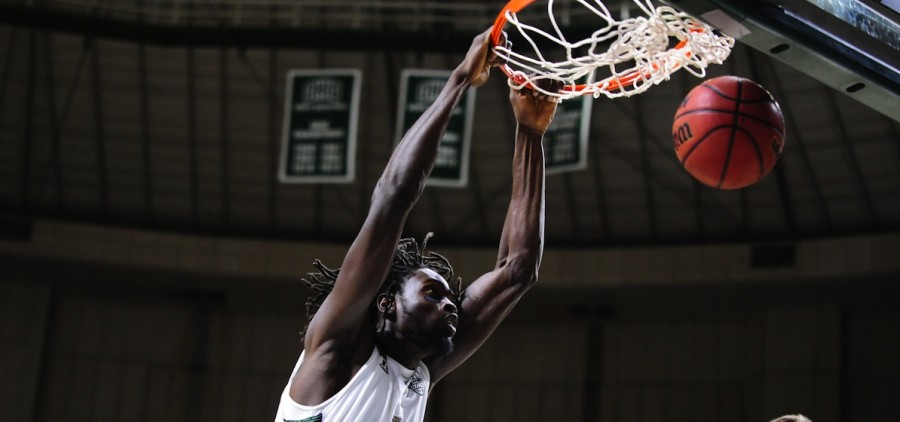 Ohio University basketball player Maurice Ndour with a slam dunk