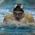 Ohio university swimmer in race with head bobbing out of water