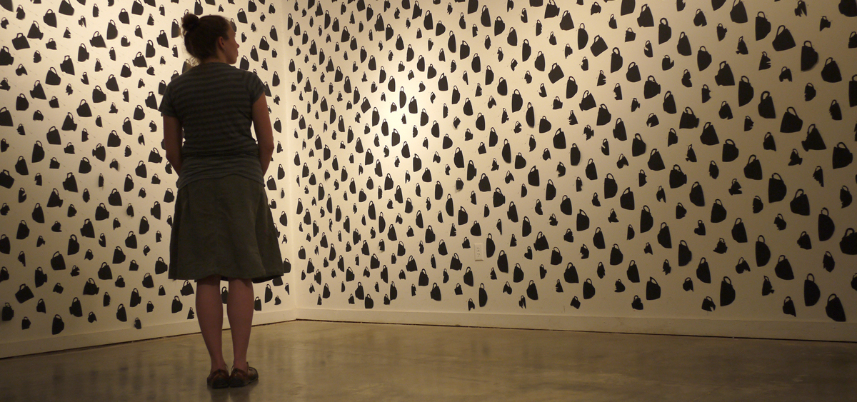 Melissa Haviland with her piece, "A Host of Options (Music for Teacups wallpaper)"
