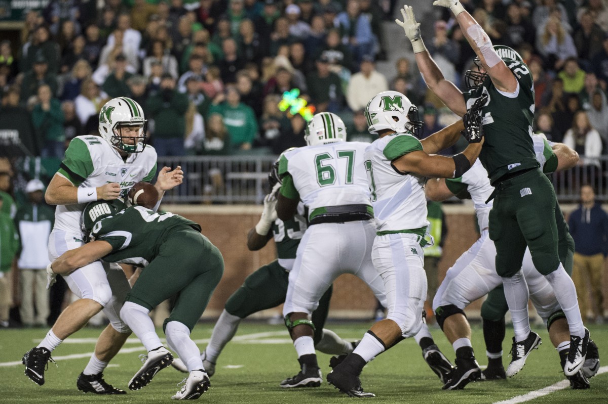 Ohio Bobcats linebacker Travis Daughertry (#50) rushes Marshall's quarterback, Michael Birdsong (#11), resulting in a fumble recovery by the Bobcats at Peden Stadium in Athens, Ohio on Saturday, September 12, 2015. The Bobcats defeated The Herd 21-10 in their first home game of the season.
