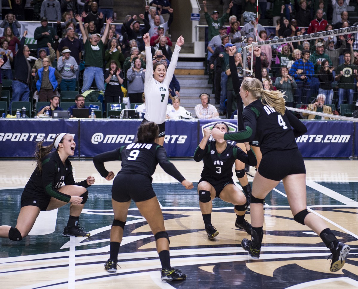 The Ohio University women's volleyball team celebrates after scoring the final point against Northern Illinois to become the 2015 MAC Volleyball Champions at the Convocation Center in Athens, Ohio, on Sunday, Nov. 22, 2015.