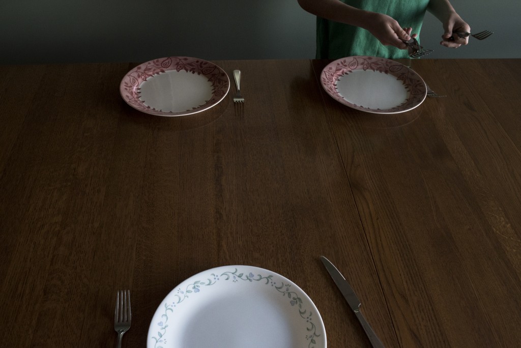 Keaton, 12, sets the table before having dinner with his brothers and sisters. Having dinner with the whole family is far and few between because of everyone's different schedules.