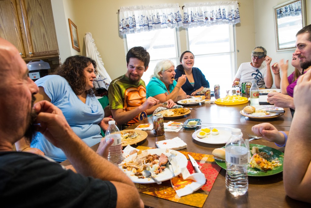 Bubba’s extended family laughs at his quick remark he made during Thanksgiving dinner.