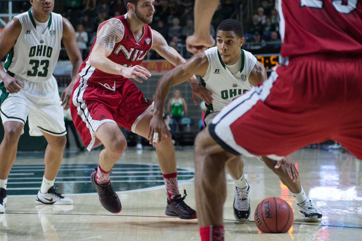 Ohio University redshirt sophomore guard Jaaron Simmons (#2) drives to the net against the Northern Illinois defense at the Convocation Center in Athens, Ohio on Saturday. The Bobcats defeated the Huskies, 80-69, and Simmons recorded his fifth double-double of the season. (Nicole Raucheisen/WOUB) 