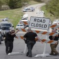 Authorities set up road blocks at the intersection of Union Hill Road and Route 32 at the perimeter of a crime scene, Friday, April 22, 2016, in Pike County, Ohio.