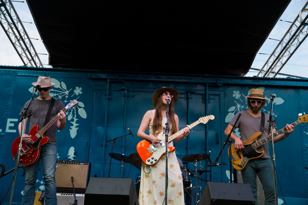 Angela Perley & the Howlin' Moons stomps and hollers on the Boxcar Stage at the Nelsonville Music Festival. (WOUB/Jasmine Beaubien)