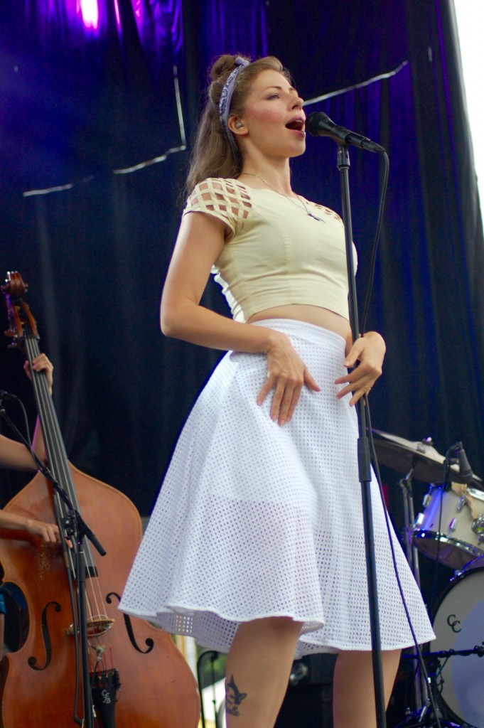 Rachael Price of Lake Street Dive sported a vintage look while performing for the semi-wet Saturday afternoon crowd. (WOUB/Shelby Coulter)