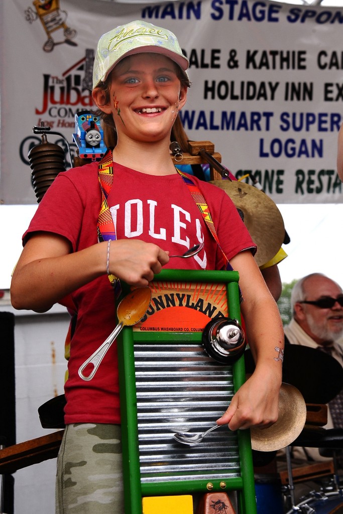 A young washboard player enjoys the festivities in Downtown Historic Logan. (Photo courtesy of festival organizers) 