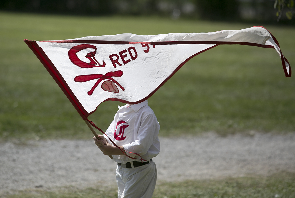 Ryan Sliter, a ball boy for the Cincinatti Red Stockings, waits for his father’s team to play. (WOUB/Jennifer Coombes)