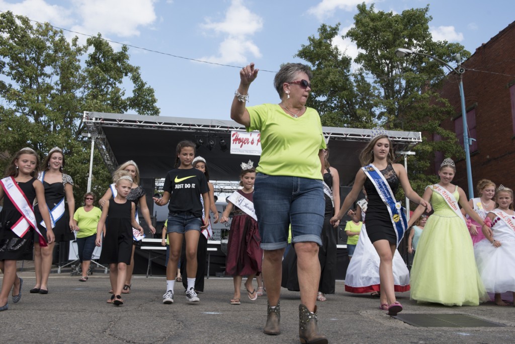 Members of the Shakin’ Stompers show several pageant winners how to line dance during the 2016 Wellston Coal Festival on Saturday, September 10, 2016.