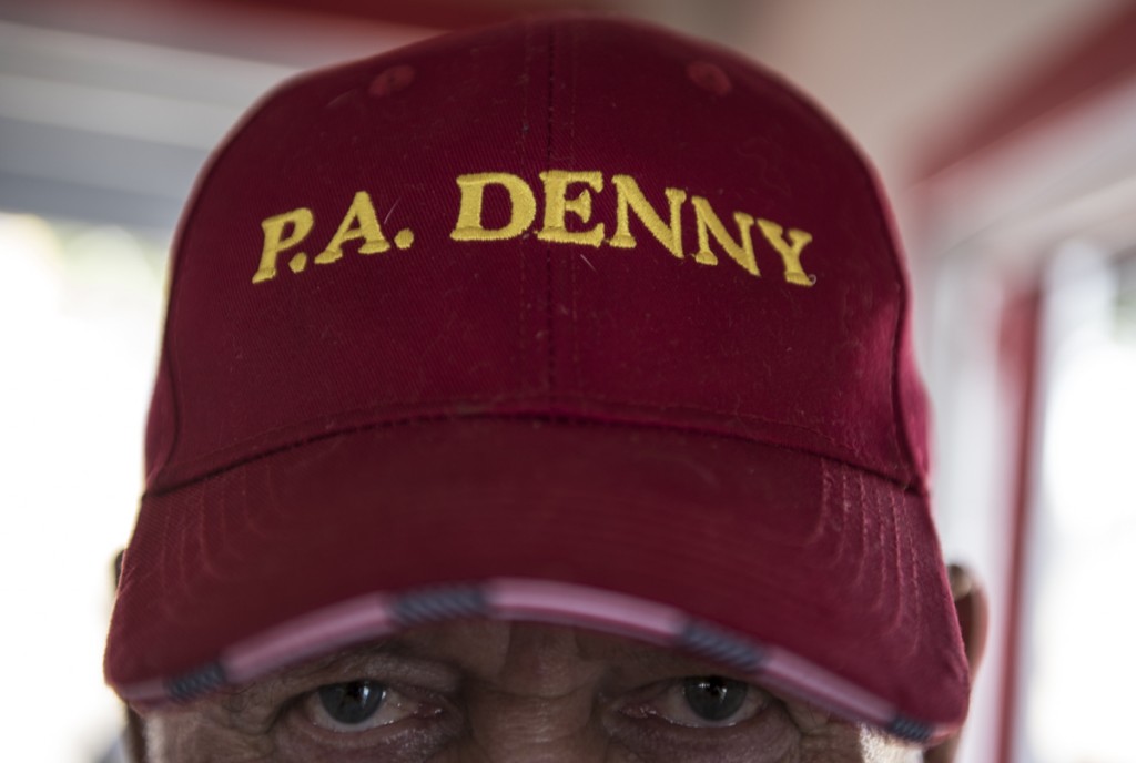 Clay, a friend  of the Heckert family, shows off his P.A. Denny hat after the sternwheel races have completed and the boats docked back onto the shores of Marietta, OH. (Robert McGraw/WOUB)