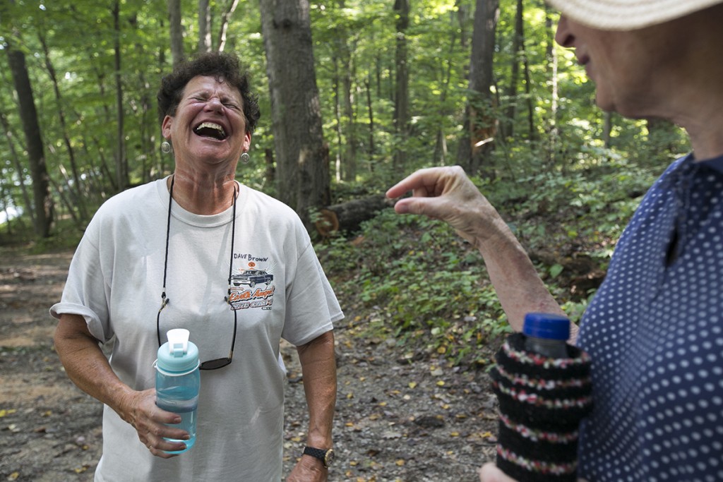 Dixie Smith, left, laughs as her friend Dixie Bosworth, right, explains the appearance and inappropriate nickname of a mushroom during a discussion about edible nonpoisonous mushrooms. (WOUB/Jennifer Coombes)