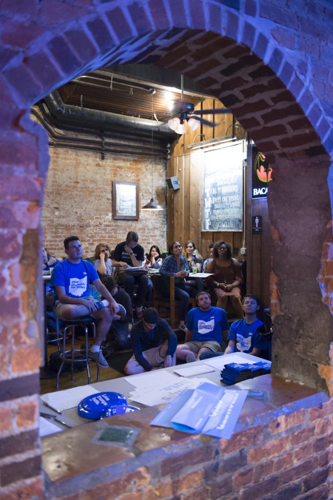 Hillary Clinton supporters gather at Pigskin Bar and Grille on September 26, 2016, in Athens, Ohio, to watch Hillary Clinton and Donald Trump debate the issues of the current presidential race. (Robert McGraw/WOUB)