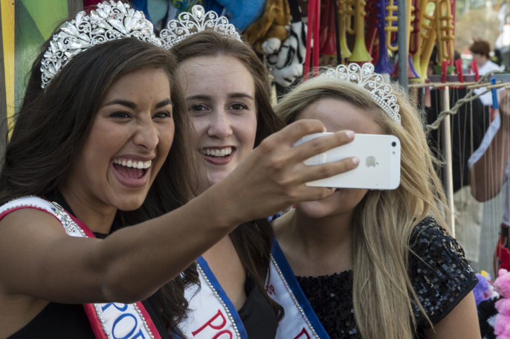 (L-R) Tori Reffitt Queen, Emily Hicks 2nd runner up, and Abbie Wright 1st runner up of the Portsmouth, Ohio River Days Festival take a selfie on Queens Day at the 2016 Wellston Coal Festival. (Robert McGraw/WOUB)