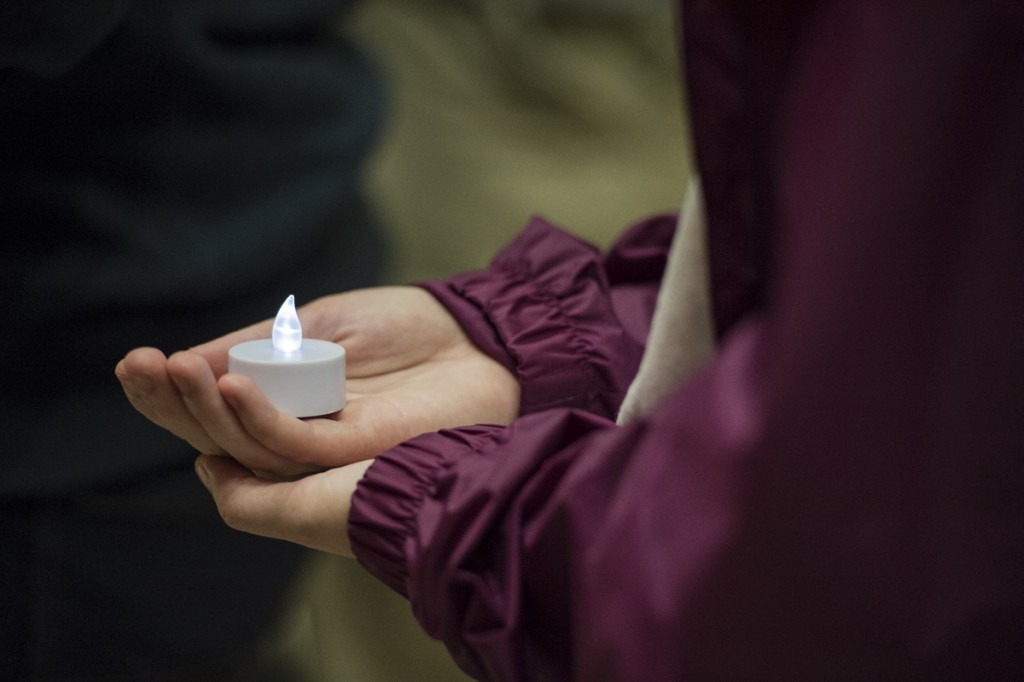 Students recognize a moment of silence as they hold small lights to honor those that are no longer with us at the 5th Annual Candlelight Vigil for Suicide Prevention. (Robert McGraw/WOUB)