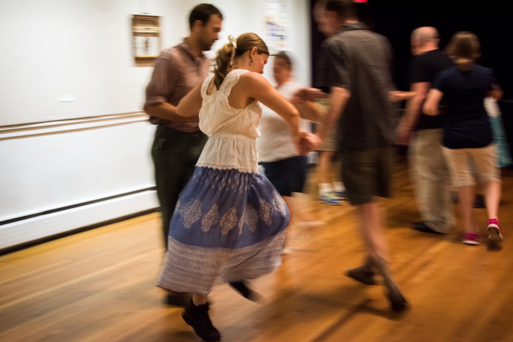 Chris Knisely, 64, getting stuck in a rotation while dancing with her partners during Contra Dancing in Athens, Ohio, on September 10, 2016. Contra dancing is a type of American folk dance, similar to line dancing where a caller is needed.