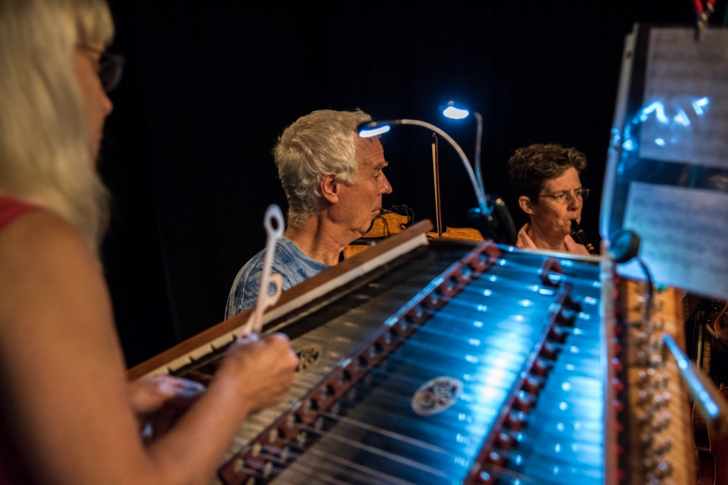 Jennie Kinsley (left) playing hammered dulcimer, Michael Allen (middle) on the fiddle, and Margaret Goodman playing the flute in The Three Rivers String Band during Contra Dancing in Athens, Ohio, on September 10, 2016.