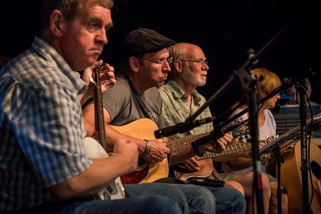 Tom Culling (left) playing banjo, Jody Durrel (middle) and Frank Guitar (right) playing guitar during Contra Dancing in Athens, Ohio, on September 10, 2016.