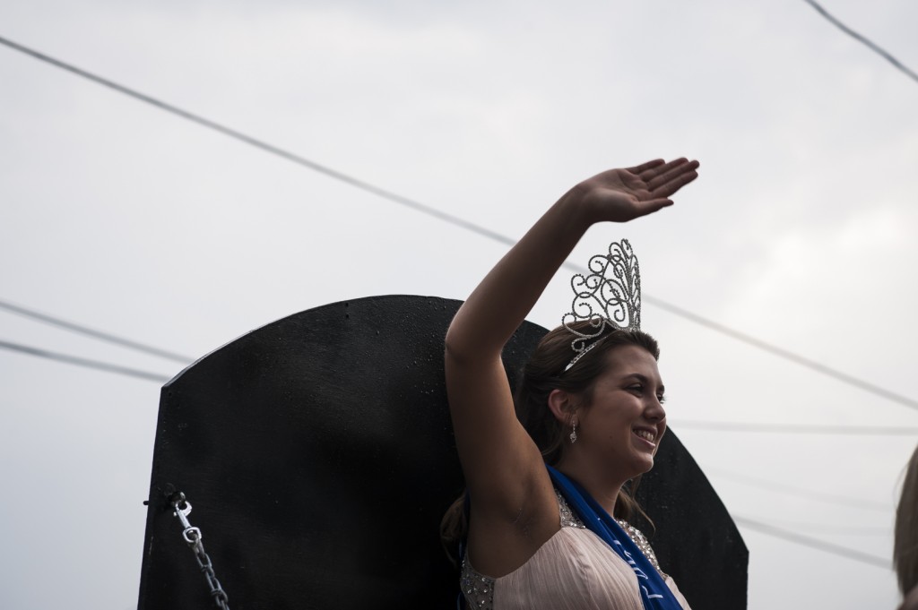 Alison Richmond, the winner of Miss Old Settlers in 2015, waves to spectators during the parade just prior to the festival in Jacksonville, Ohio on August 31, 2016. (MICHAEL SWENSEN/WOUB)