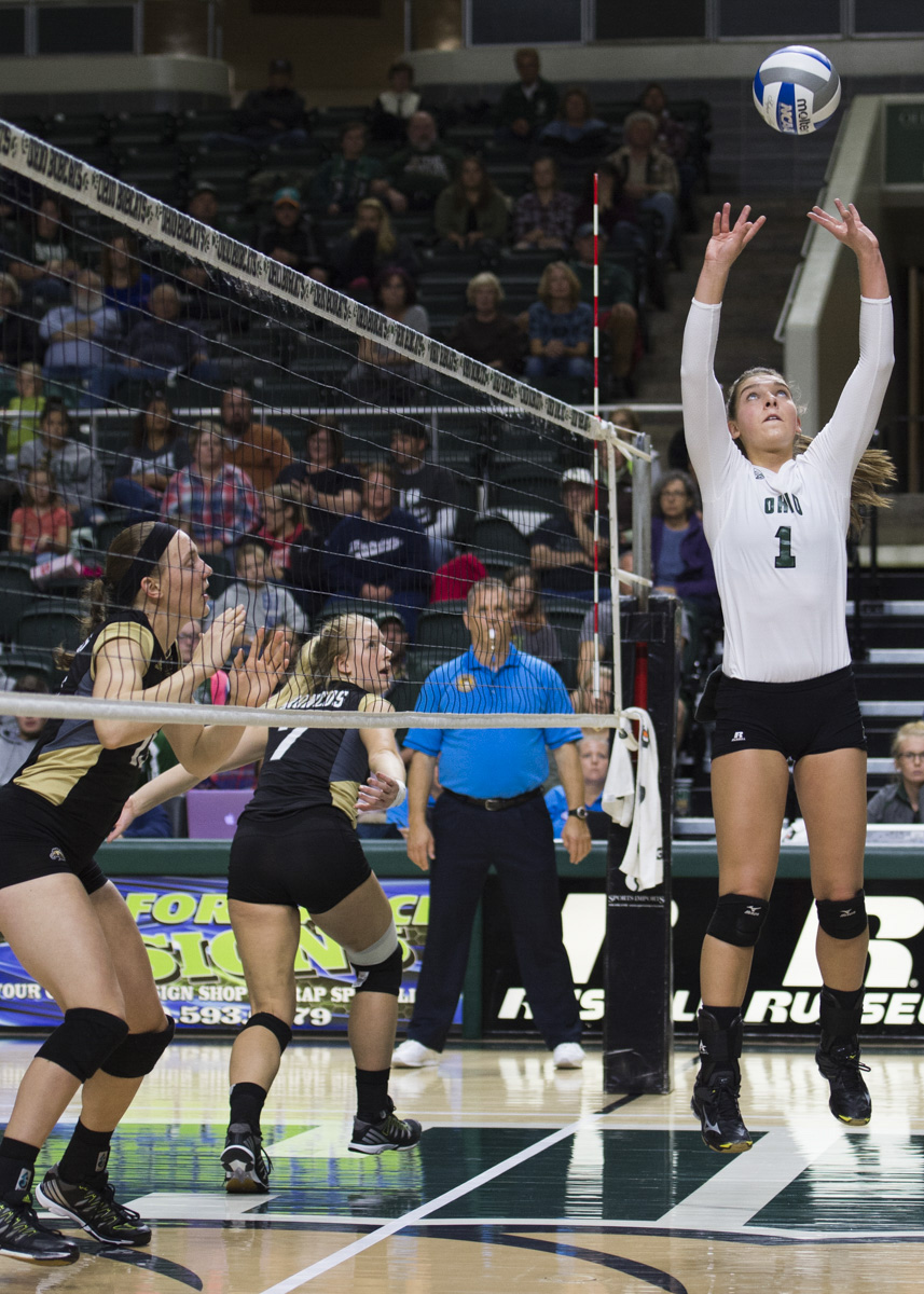 Stephanie Olman attempts to block the ball and send it back over to Western Michigan to keep it in play on October 22, 2016. (Robert McGraw/WOUB)