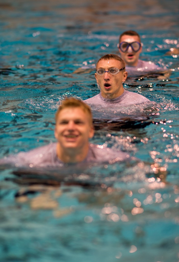 Cadets Caleb Cline (front), Luke Hamlin (Middle), and Joey Madsen trending water in the pool during the ROTC’s Water Survival Lab in the Aquatic center at Ohio University on October, 26, 2016.