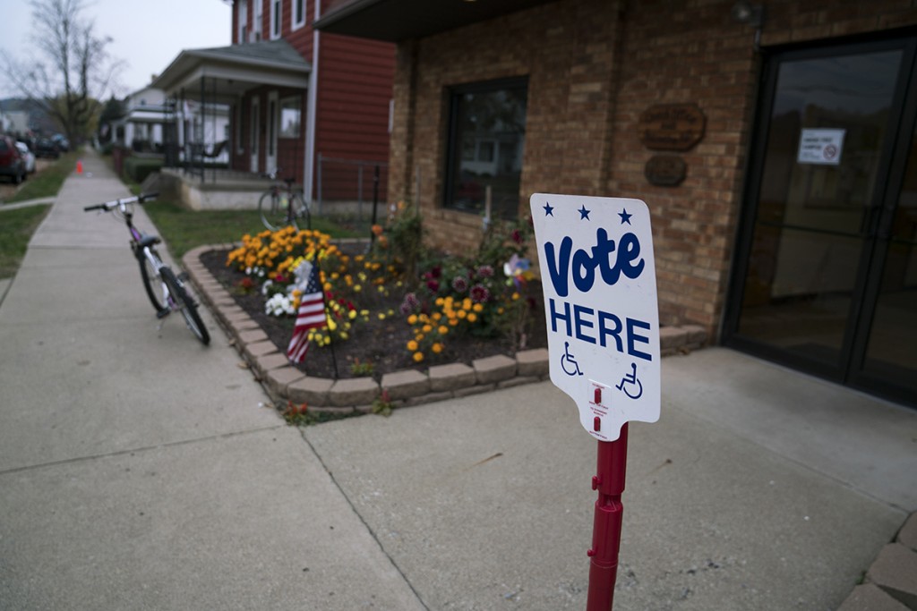 A sign outside of the Nelsonville voter precinct lets people know where they can vote. (Michael Swensen/WOUB)