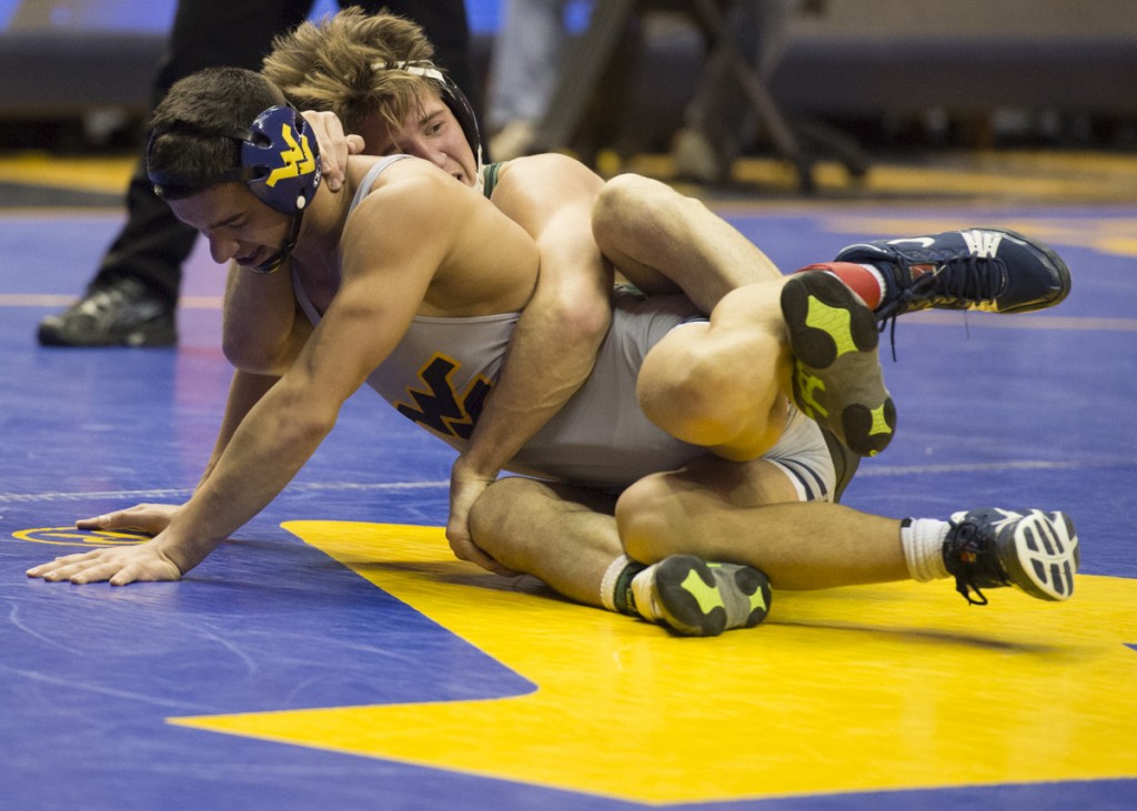 Cameron Kelly, top, at the WVU Mountaineer Quad on November 6, 2016, in Morgantown, W.Va. He would win against WVU’s Cory Stainbrook. (Robert McGraw/WOUB)