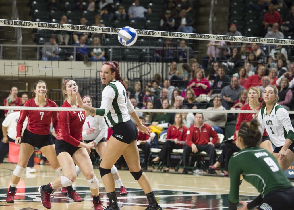 Katie Nelson, 2, watches as Erica Walker, 9, attempts to hit the volleyball returned by Miami on Friday, November 4, 2016. (Robert McGraw/WOUB)