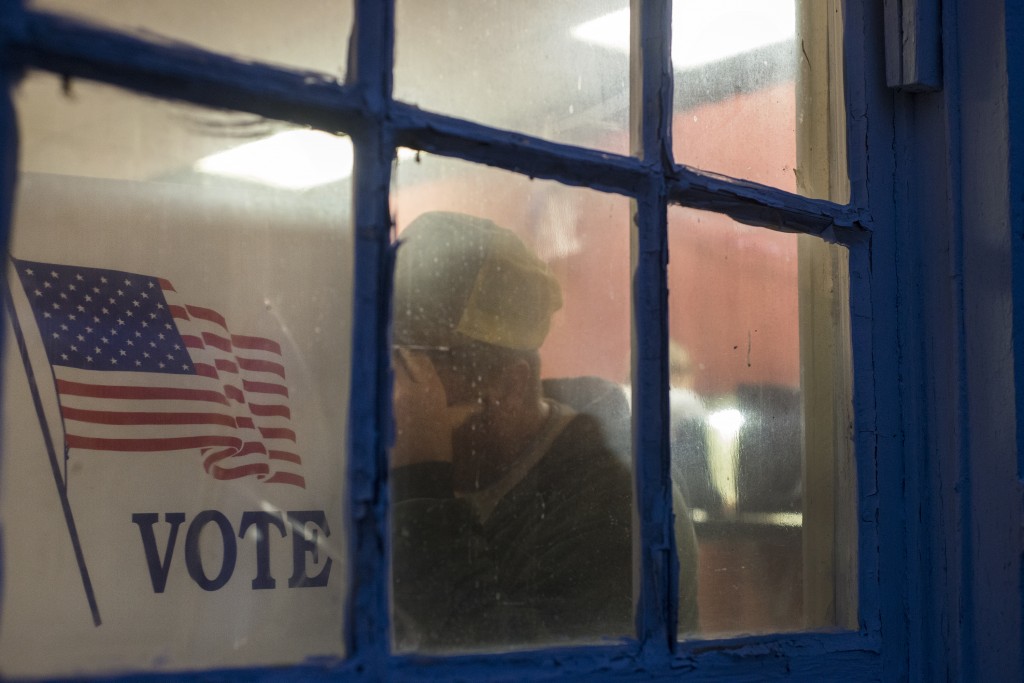 Wes Davidson votes inside the old schoolhouse in Harrison Township on Election Day on Tuesday, Nov. 8, 2016. This small polling place was expecting to have over 700 people voting. (Kelsey Brunner/WOUB)