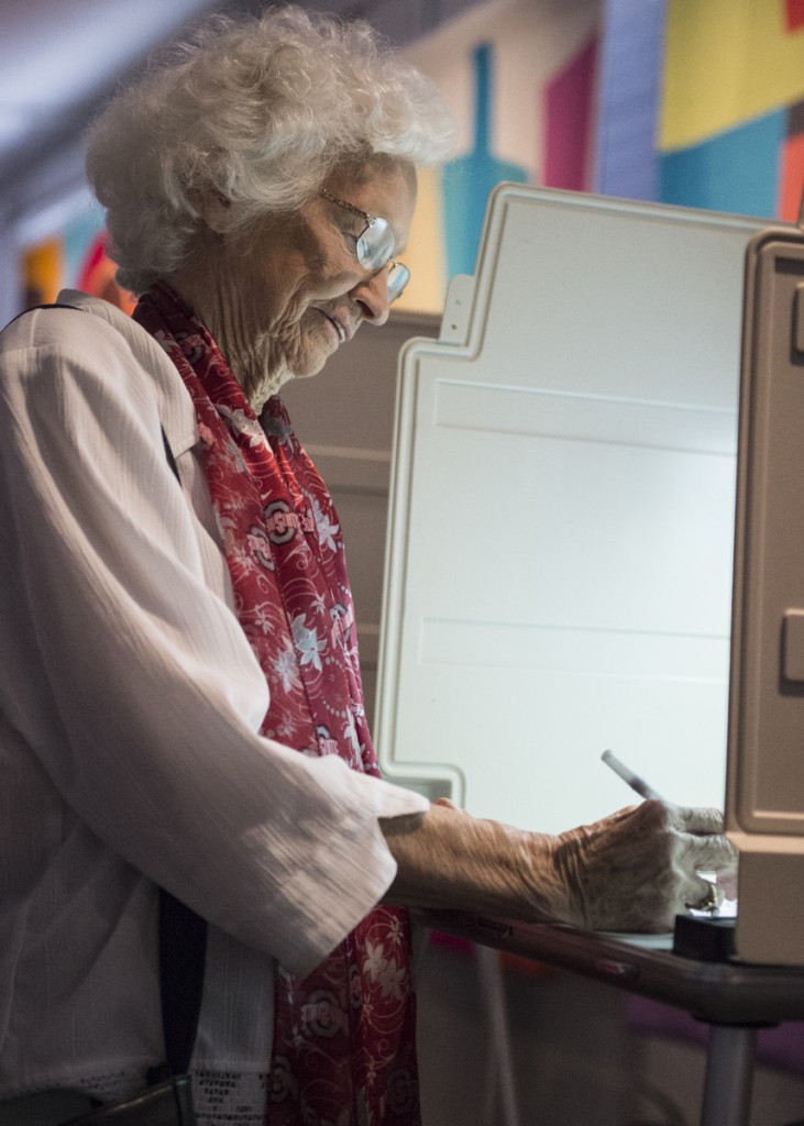 In her 80s, Glenna Grim makes sure to come out and vote at the Dairy Barn Arts Center in Athens, Ohio, on November 8, 2016. “I want to make sure the right person gets in,” said Grim. “My generation always voted and it is the duty of every American citizen to do the same.” (Robert McGraw/WOUB)
