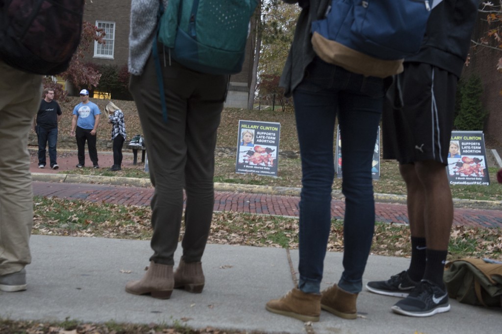 Bobcats for Life put out signs to educate voters on Hillary Clinton’s stances on abortion outside of Baker Center in Athens, Ohio, on November 8, 2016.