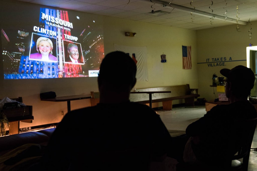 Attendees of the Democratic watch party observe polling numbers come in on Super Tuesday in Nelsonville, Ohio. (Michael Swensen/WOUB)