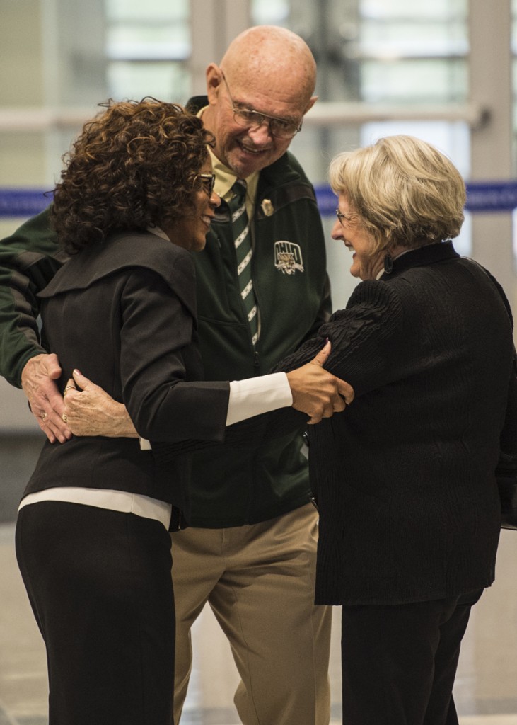 Dean Renée Middleton, left, of the Patton College of Education welcomes Ray Asik, middle, a 1963 Ohio University graduate, and Dr. Ellen Goldsberry, right, who got her masters at Ohio university in 1964 before the ribbon cutting ceremony of the newly renovated McCracken Hall  on January 27, 2017. (Robert McGraw/WOUB)