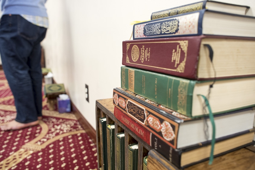 A stack of books are displayed in the Islamic Center's Mosque during a breakfast in Athens, Ohio on January 20, 2017. (Camille Fine/WOUB)