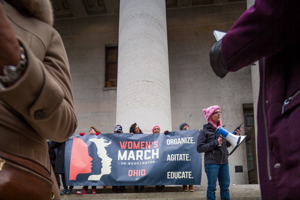 Event Organizer Lindsey Marie Shriver directs the crowd at the WMW Ohio Sister March in Columbus, Ohio on January 175, 2017. (Erin Clark/WOUB)