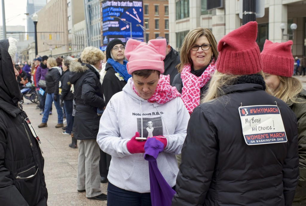 On January 15, 2017, rally participants at the WMW Ohio Sister March display “pinned concerns” to the back of their clothing to wear when they march at the Women’s March on Washington. (Margo Sabec/WOUB)