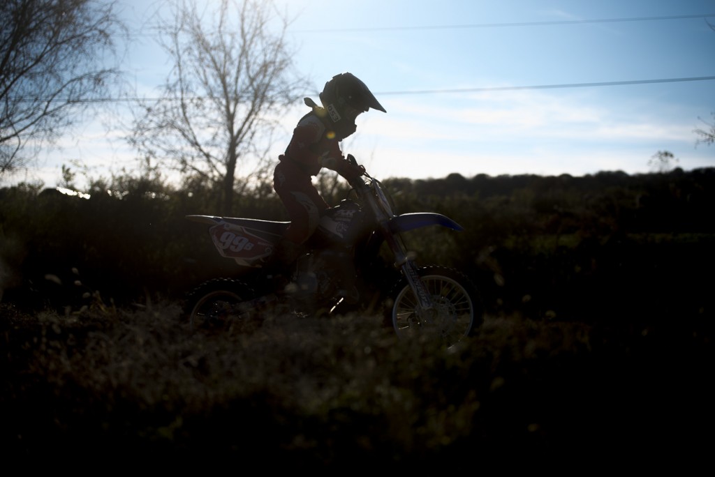 Tanner Collins rides his dirt bike at the Cunningham's race track in Nelsonville, Ohio on November 5, 2016. The Cunningham's often invite their friends and family over to practice and socialize.