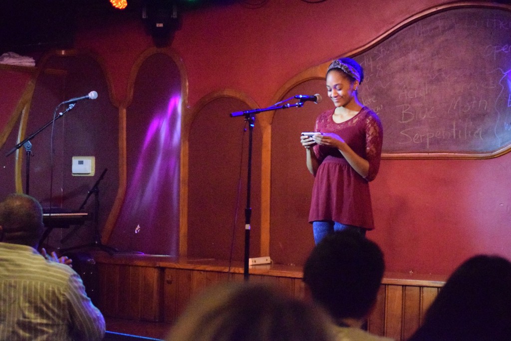 Adrianna Mauzy reads her original poetry at the event.  Photo by Elise Hammond.