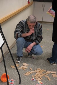 Stumped, Craig Gibbs looks at the puzzle pieces scattered aross the ground, hunting for clues. February, 4, 2017.