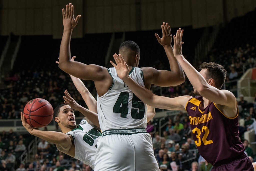 Jordan Dartis (35) goes for a layup while falling down against the Central Michigan Chippewas. (Nickolas Oatley/WOUB)