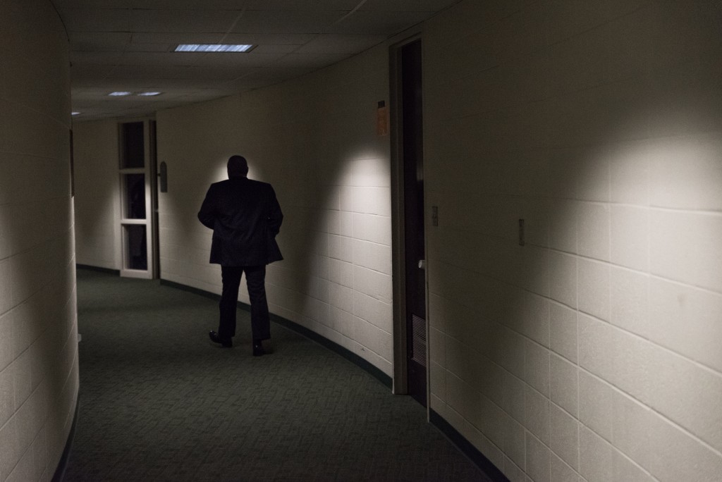 Ohio University President Roderick McDavis walks down the hallway of the Convocation Center after walking out onto center court on Tuesday, February 7. This is McDavis' last home game he will be attending as President of the University.