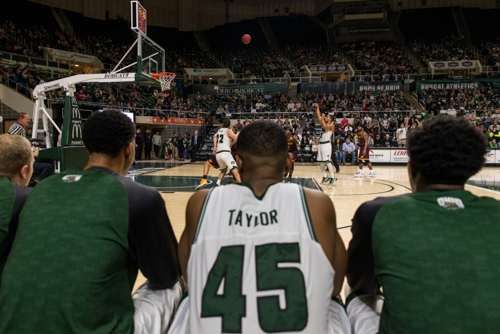 Teammates watch as Jaaron Simmons (2) shoots a free throw from the line. (Nickolas Oatley/WOUB)
