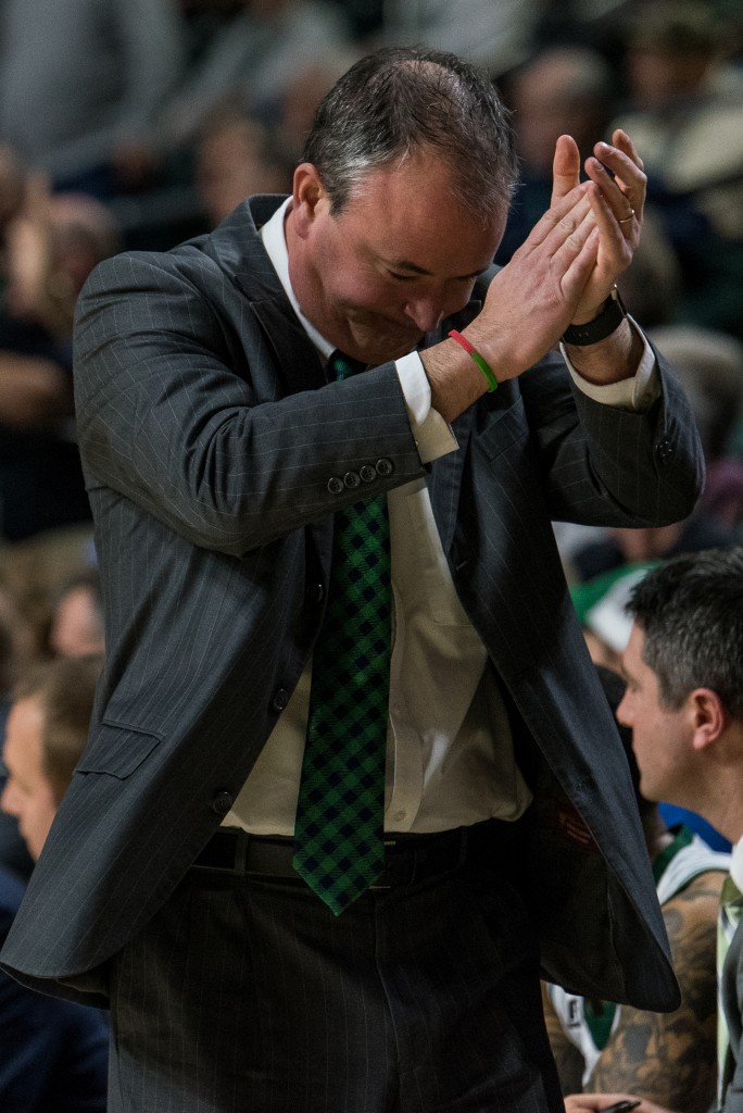 Ohio University Men's basketball coach Saul Phillips claps after Central Michigan gets called for a charge. (Nickolas Oatley/WOUB)