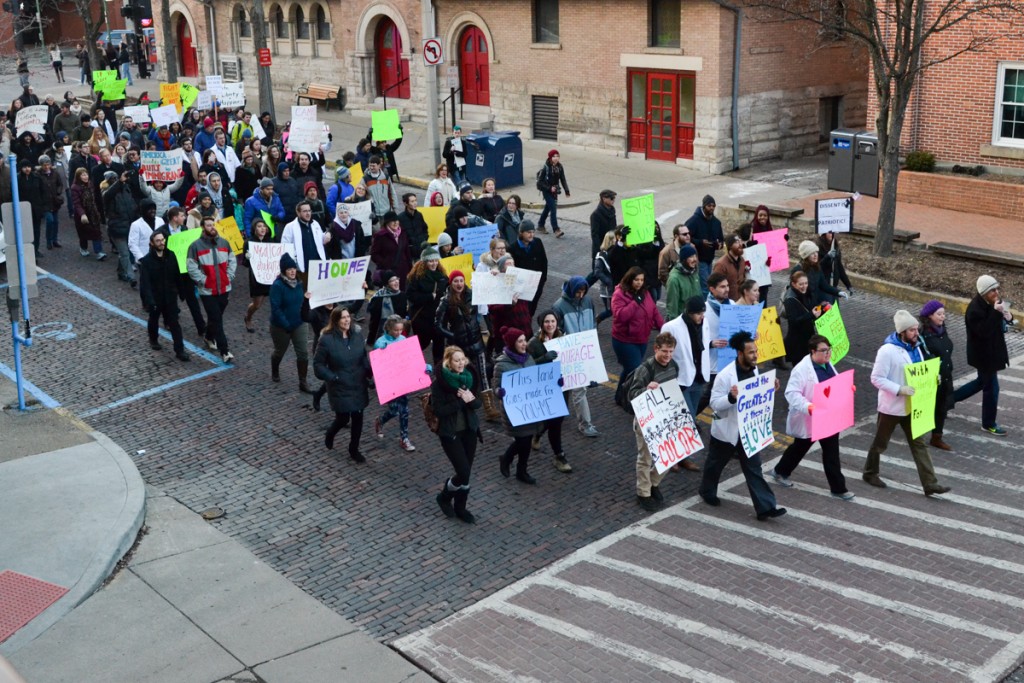 Protestors march down East Washington Street at the Healthcare Allies Asylum March in Athens, Ohio on February 3, 2017 (Robert Green/WOUB)