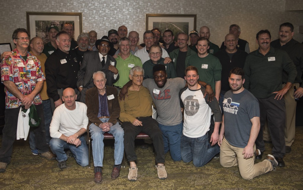 Previous wrestlers from Ohio University’s nearly 100 year wrestling program take a group photo with Coach Greenlee at the first Alumni event of the weekend on February 18, 2017.(Robert McGraw/WOUB)