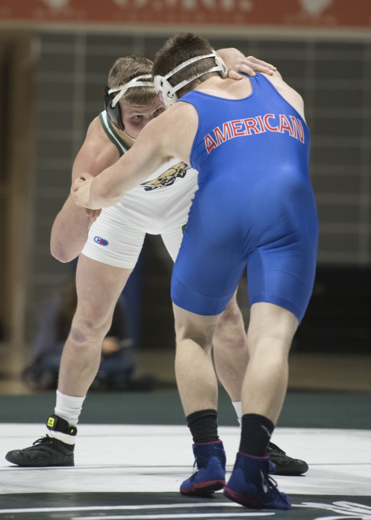 Austin Reese wrestles American’s Michael Eckert and would stay tied during the first two periods. (Robert McGraw/WOUB)