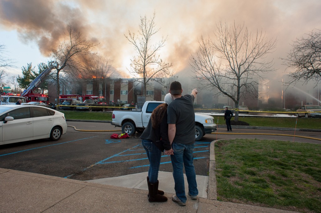 Bystanders watch the fire on February 26th, 2017 from the Carriage Hill parking lot. (Drake Withers / WOUB)