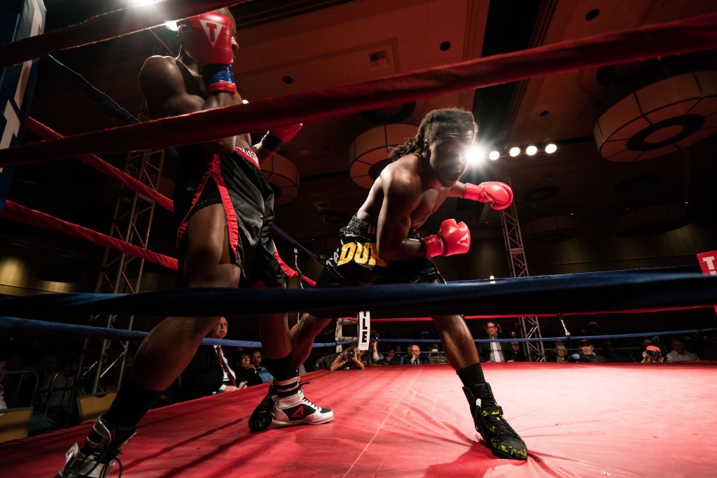 Antwan Jackson swings a punch at Mohamed Abdullah in the corner of the ring. (Nickolas Oatley/WOUB)