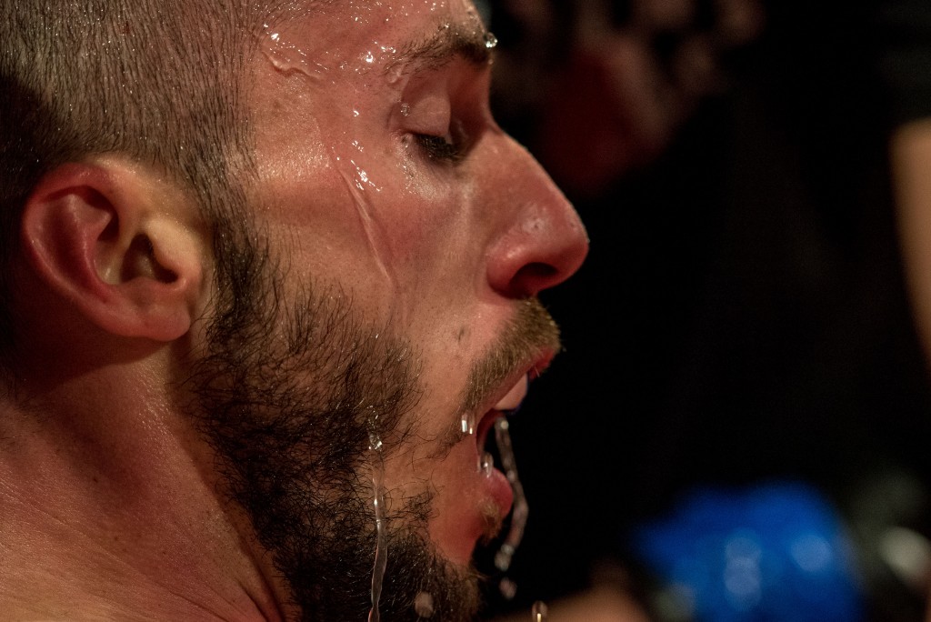 Will Goslin has water poured on his face before boxing in the Pro Boxing match for the Arnold Sports Festival. (Nickolas Oatley/WOUB)
